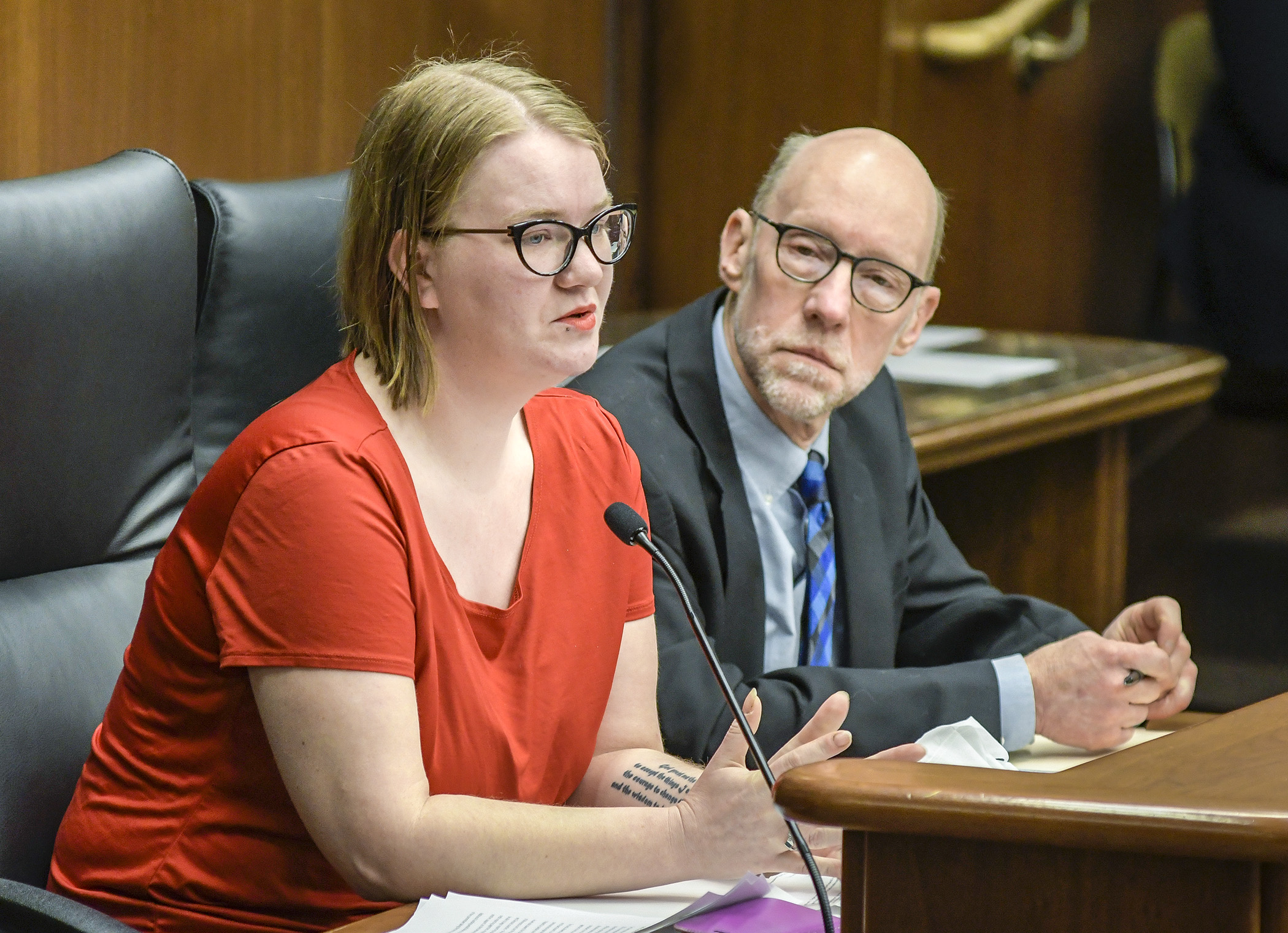 Missy Juliette testifies before the House Jobs and Economic Development Finance Division Feb. 5 in support of a bill sponsored by Rep. Jim Davnie, right, that would fund a loan resolution and financial stability program. Photo by Andrew VonBank